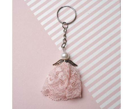 An Angel Keyring made from the lace of Lisa Snowdon's peach bra and silver metal findings. Approx size including key ring H10