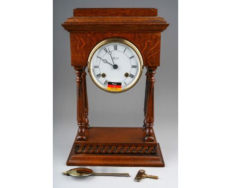 A Modern German "Hermle" mantle clock, with key and pendulum (appears brand new, untested)