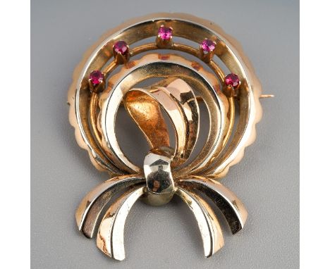 An mid 20th century synthetic ruby, designed as an abstract design bow set with synthetic ruby accents, stamped 750, 750AL, a