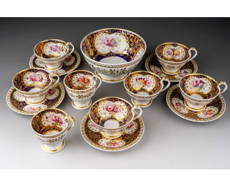An early 19th Century part tea set to include: five teacups, two coffee cups, five saucers and slope bowl, cobalt blue ground