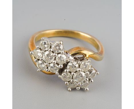 A 9ct gold diamond double cluster ring, set with round brilliant cut diamonds, estimated total diamond weight 1.10cts, assess