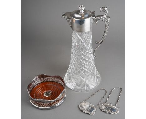 An Elizabeth II silver mounted cut glass claret jug, with mask spout and beast head thumb piece above cast scroll handle, sta