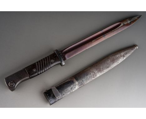A WW2 Third Reich Mauser K98 bayonet by Berg &amp; Co  complete with scabbard, with matching serial numbers 1784 and dated 19