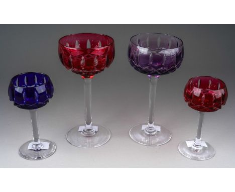 Four John Walsh coloured cut glass wine and port glasses, amethyst, ruby x 2 and cobalt) on clear stems (4)