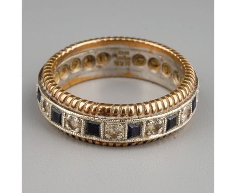 A 9ct white and yellow gold eternity ring, set with alternating white and blue stones, size M, gross weight approx 5g