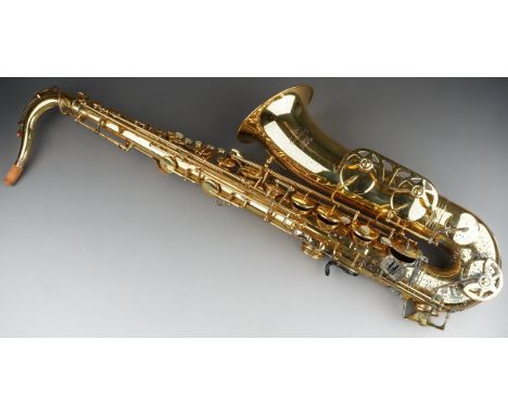 A cased Evette Buffet Crampon tenor saxophone in heavily rusted and tarnished condition