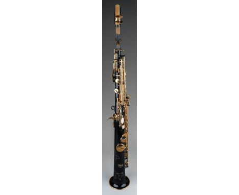 A cased Opus Soprano saxophone, black lacquered and brass finish, some small areas of tarnish  rust noted