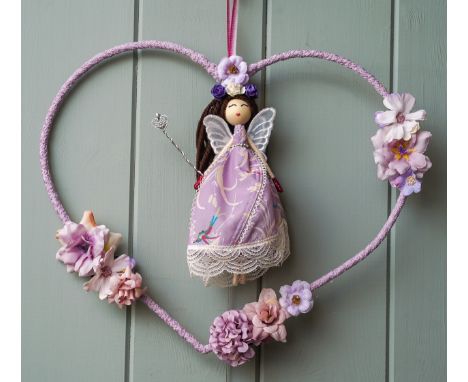 A Fairy made from the fabric from Hayley Sparke’s bra & additional materials, placed in a heart shaped frame that has been de