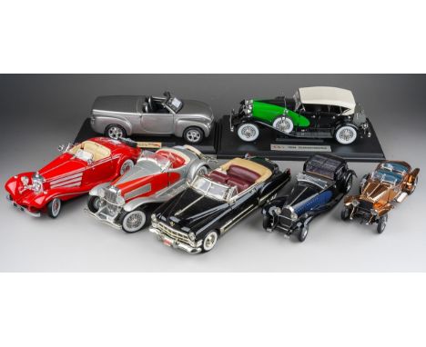 A collection of seven die cast model cars, mainly 1:18 to include: mounted 1934 Duesenberg; Danbury Mint 1935 Duesenberg SSJ 