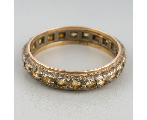 A paste set yellow and white metal eternity ring, set with colourless paste, stamped sil 9ct, approximate ring size N 1/2, ap