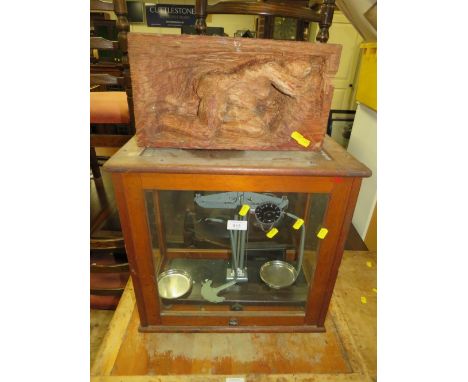 A CASED SET OF CHEMISTS SCALES WITH AN UNUSUAL CARVED FIGURATIVE BLOCK (2)