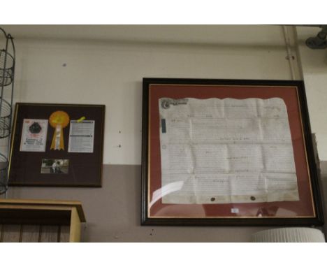 A LARGE FRAMED ANTIQUE INDENTURE TOGETHER WITH A FRAMED VINTAGE MOTORCYCLE DISPLAY (2)