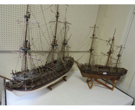 A VINTAGE SCRATCH BUILT MODEL OF A GALLEON TOGETHER WITH A LARGER EXAMPLE 