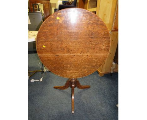 A 19TH CENTURY CIRCULAR OAK TILE TOP TABLE