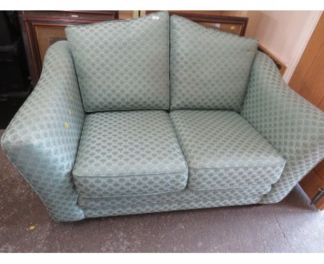 A TWO SEATER SPRUNG EDGE FABRIC SOFA
