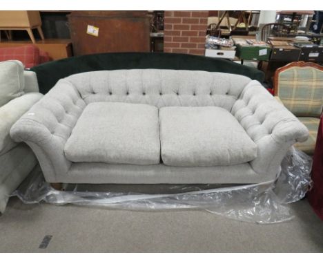 A MODERN UPHOLSTERED BUTTON-BACK SOFA 