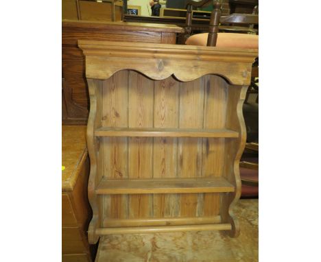 AN EDWARDIAN OVERMANTLE MIRROR AND PINE HANGING SHELF