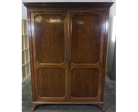 Mahogany Wardrobe, circa early 20th century, Having A Dentil Cornice above two Doors, Raised on Bracket Feet, 92cm high, 144c