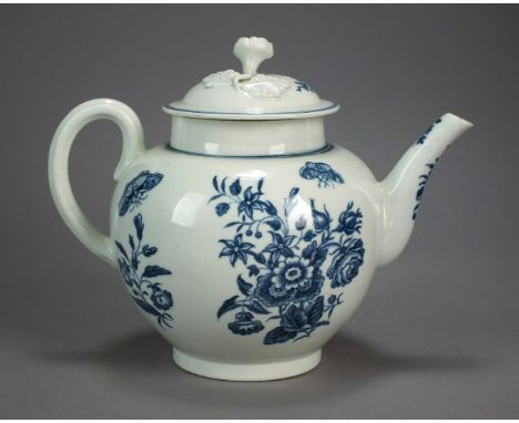 A Worcester porcelain teapot and cover transfer-printed in the Three Flowers pattern, circa 1775, hatched crescent mark, 15.5