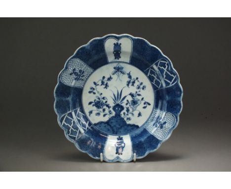 A Caughley powder blue fluted plate in the Holed or Flaming Rock design, circa 1778-80, impressed Salopian mark, 22cm diamete