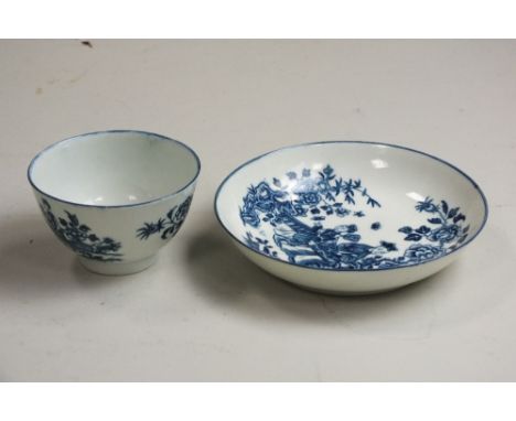 A Worcester porcelain tea bowl and saucer, circa 1770-75, transfer-printed with Chinese figures, hatched crescent mark, sauce