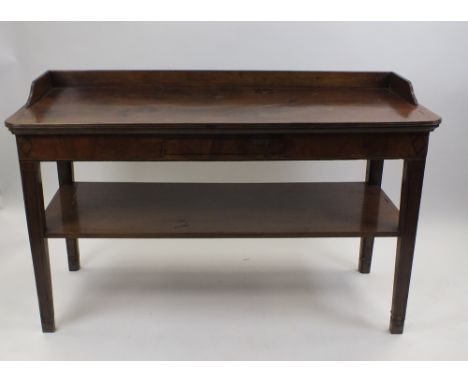 An early 19th century mahogany ebony and boxwood strung buffet with low gallery back above an ebony strung frieze and lower s