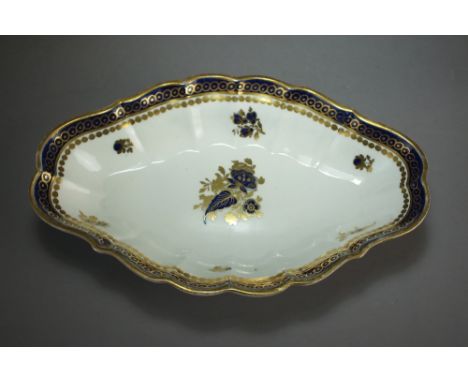 A Caughley porcelain dessert centre dish painted in underglaze blue and overglaze gilding with Dresden Flowers, circa 1790, p