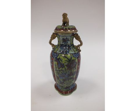 A Chinese blue and white 'clobbered' vaseQing Dynasty, 18th/19th CenturyOf lobed ovoid form with twin chilong handles and lio