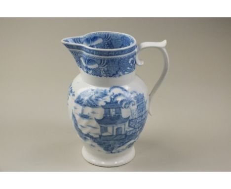 An early Coalport porcelain jug, circa 1800, transfer-printed in blue and white in the Willow pattern, unmarked, 23cm high