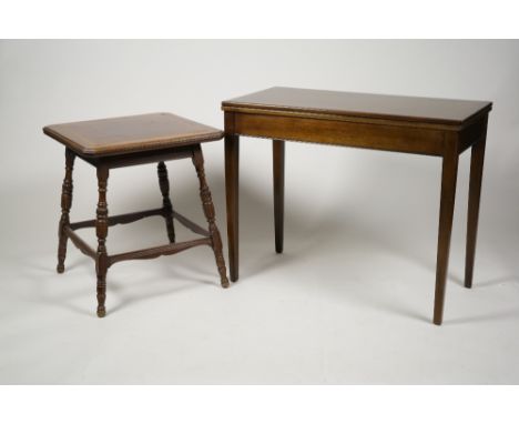 A mahogany card table, the rectangular fold over top enclosing a baize lined playing surface on four square tapering legs, 91