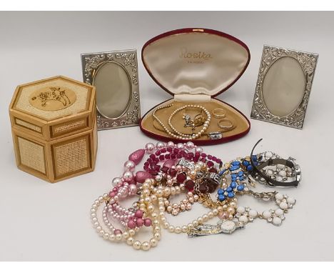 Jewellery and wristwatches to include faux pearl necklaces, earrings, two photograph frames and other items Location: Port 