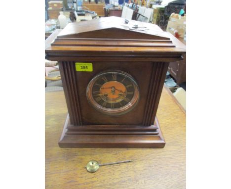 A Victorian mahogany cased mantel clock, gilt dial with black Roman chapter ring, an 8-day movement striking on a bell (with 