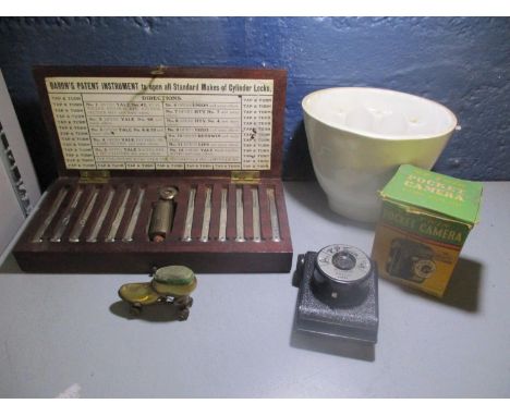 A Victorian brass pin cushion in the form of a roller skate, boxed Baron's patent instrument tool set to open all types of cy