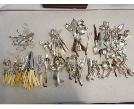 Silver plated flatware to include Victorian serving tongs and mother of pearl handled examples Location: 6.5 