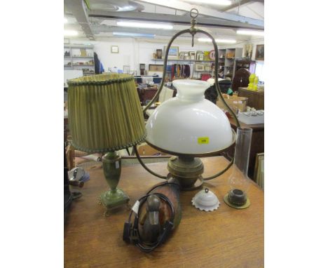 A Hinks brass hanging ceiling oil lamp with opaline shade, smoke funnel and porcelain ceiling rose, a green alabaster table l