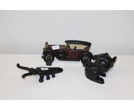 Three pieces of vintage cast iron including doorstop etc 