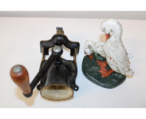 A antique cast iron doorstop and meat grinder 