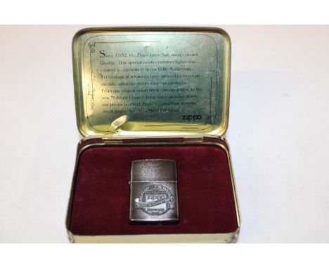 A boxed Zippo 60th anniversary lighter (Unused) 1932-1992 