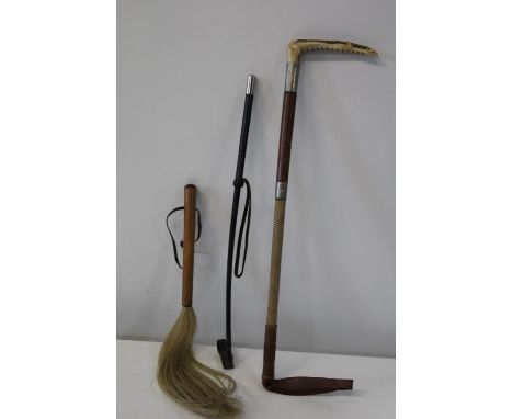 Two vintage riding crops and a swish stick 