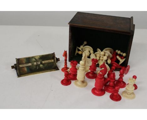 A vintage ivory chess set (damaged) and a brass perpetual desk calendar 