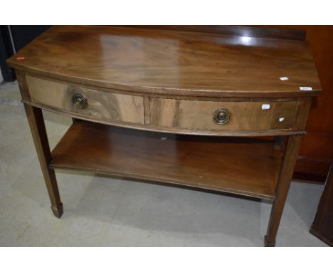 A Victorian Regency design sideboard or console table having curved frontage with tapered legs and mahogany frame