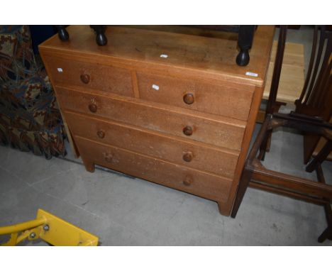 A vintage golden oak chest of two over three drawers, possibly Gomme
