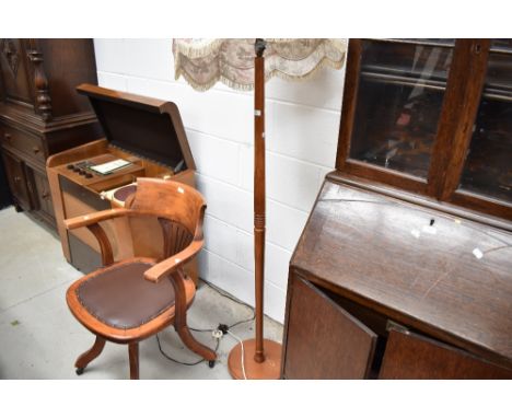 A mid century turned teak standard lamp