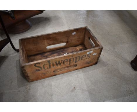 A vintage Schweppes crate