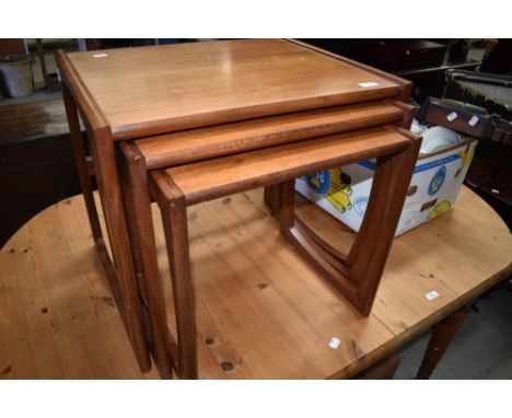 A vintage teak G plan nest of three tables