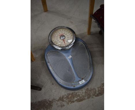 A set of vintage EKS bathroom scales