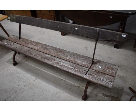 A vintage bench , reversible with cast frame, possibly station or steamer