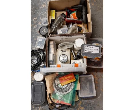 A large collection of motorcycle spares, tools and cables. 