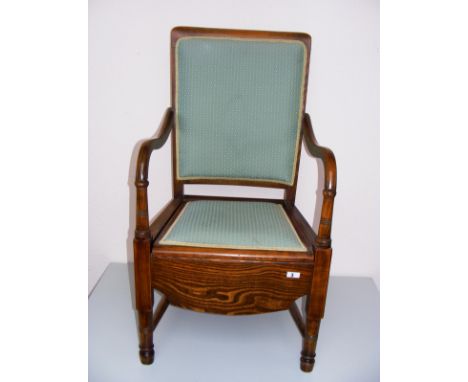 A Victorian mahogany commode chair.