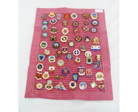 A sash of enamel badges.